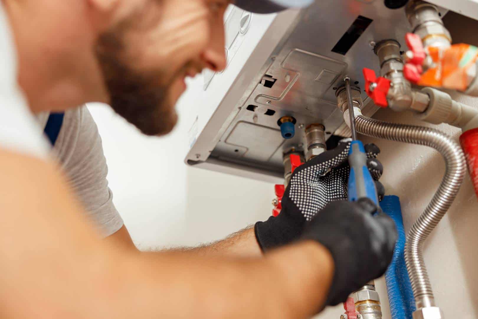 ambient cooling heating service areas crofton hvac services - Ambient Cooling & Heating A professional taking care of an HVAC repair.
